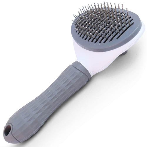Cepillo quita-pelo NUKO gris visto de frente, con las púas metálicas